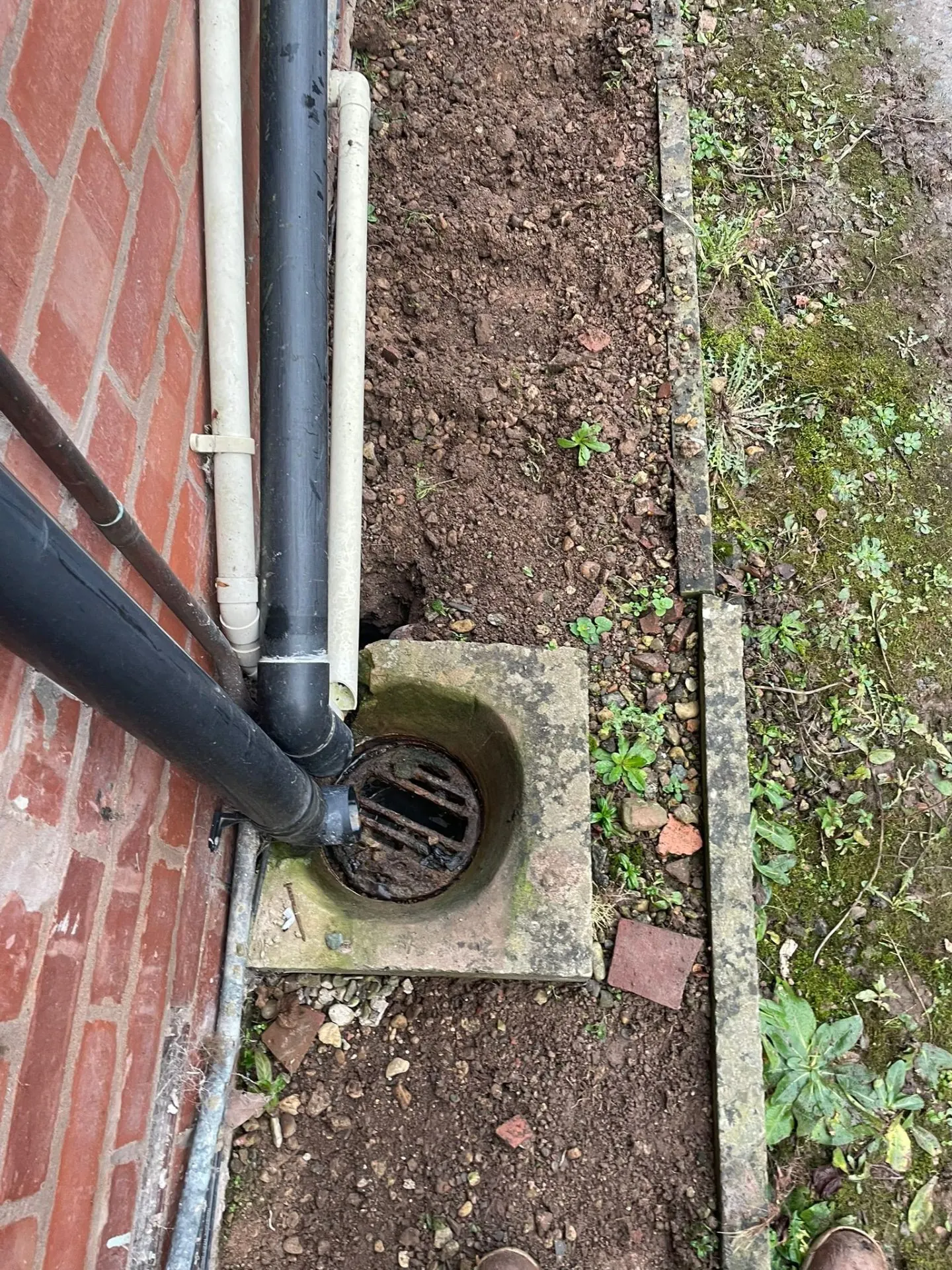 Tired gully → new drain & surround — before